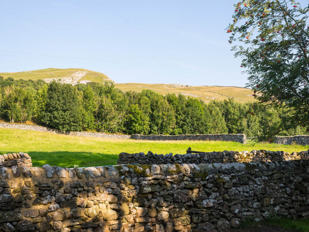 a landscape shot of a Yorkshire Dales fell rising up at the front of Settledown Retreats